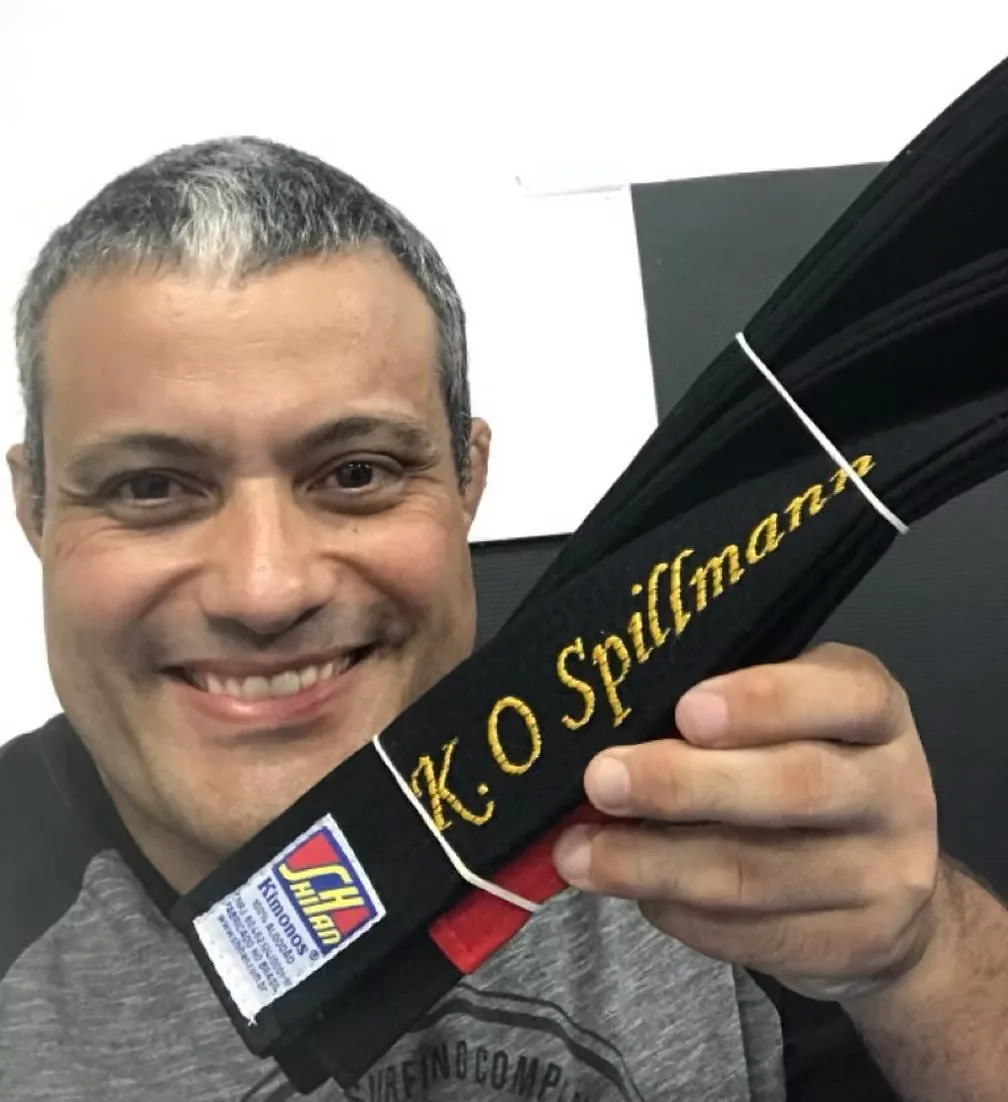 Master Rocian Gracie Jr presenting Professor Konrado his black belt, embroidered K.O. Spillmann